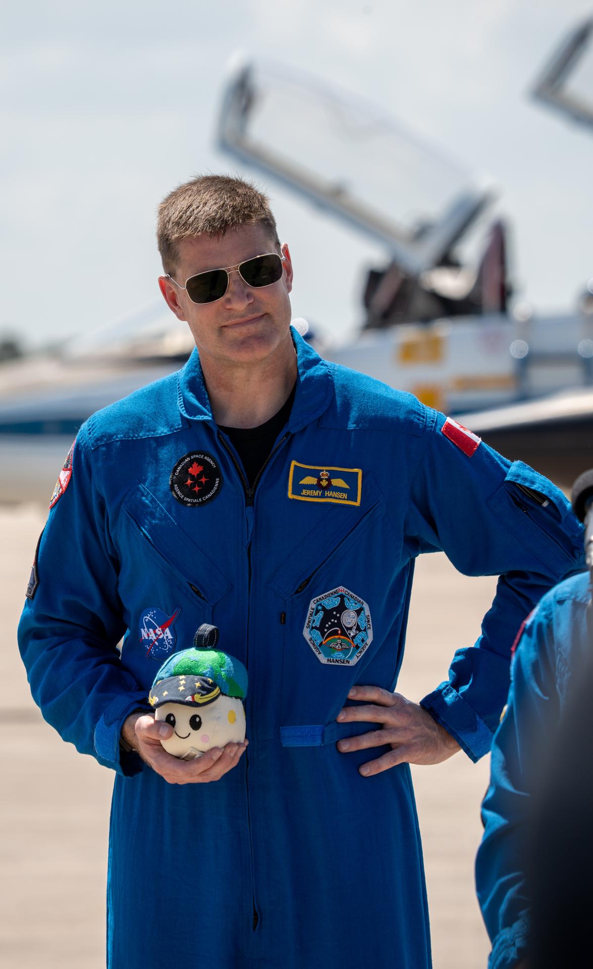 These images show the moments shortly after the arrival of the Artemis II crew to NASA’s Kennedy Space Center on March 27, 2026 ahead of the launch. The four astronauts, Victor Glover, Reid Wiseman, Christina Koch, and Jeremy Hansen, arrived on a T38, which can be seen behind them. They took turns speaking to the crowd as they also announced the zero-gravity indicator they would be taking with them on their journey.